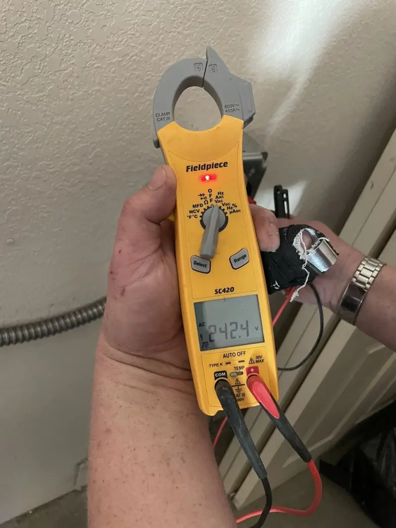 Voltage testing with clamp meter during Outlet Installation in Brookridge